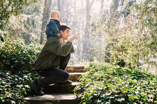 Father and baby son in spring nature