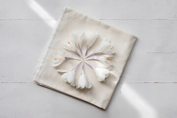 White crocus gathered on cotton napkin