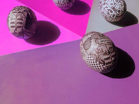Custom made handmade easter eggs arrangement in pastel colored papers / background