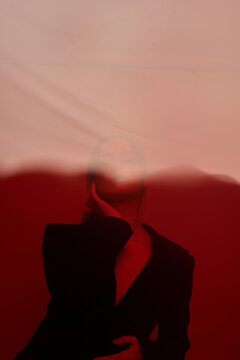 Portrait of a young blond girl in a suit 