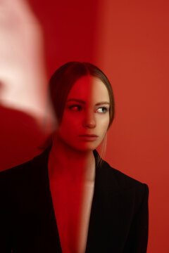 Portrait of a young blond girl in a suit 