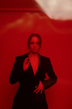 Portrait of a young blond girl in a suit 