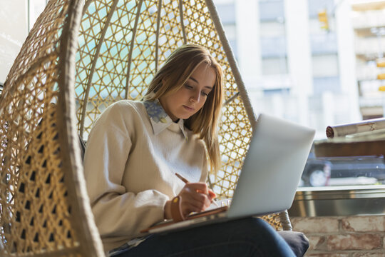 Woman consulting customers online 