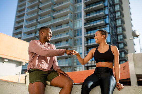 Two Friends Smile While Exchanging and Encouraging Fist Bump