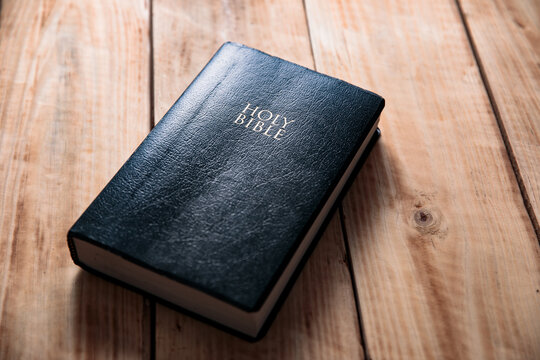 Holy Bible On The Wooden Table