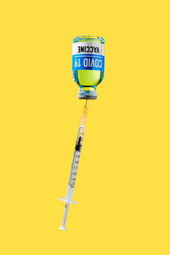 covid-19 vaccine and syringe upside down