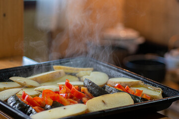plate with steaming roasted vegetables