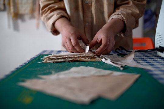 Woman hands working with natural fabrics