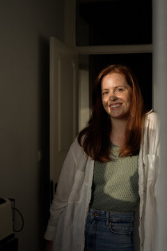 Ginger woman standing portrait with shadow