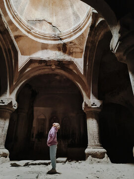 
Woman inside an old abandoned temple