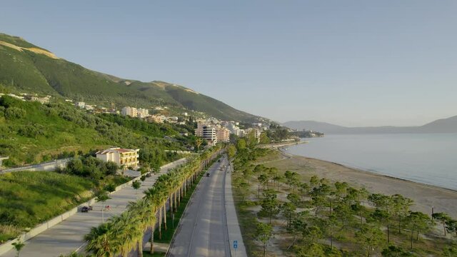 Aerial view of Cameria Road (Rruga Cameria). Road running along the coast of the Adriatic Sea. Main road in Vlore city, with palm trees
