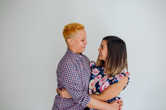 Female partners embracing  - Powered by Adobe