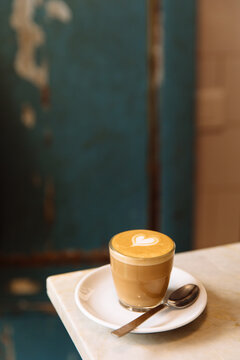 Cortado coffee drink with heart latte art