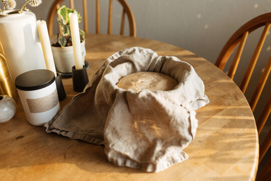 Uncooked sourdough bread dough sitting in bowl 