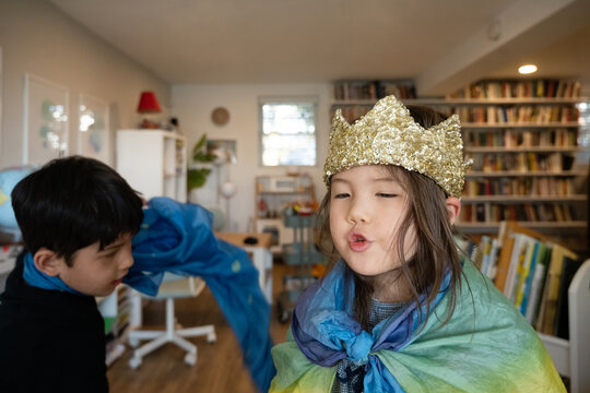 Kids playing in costume indoors
