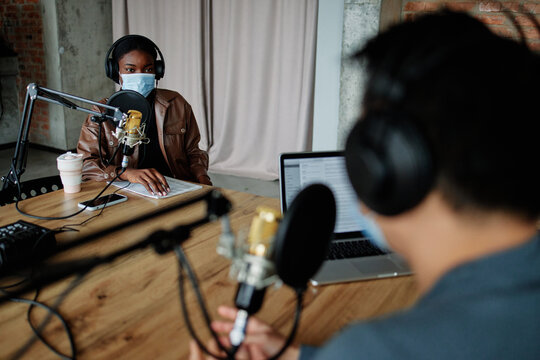 Woman recording podcast during pandemic 