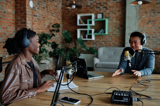 Professional speakers smiling during conversation 