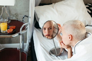 Young woman lying on the bed.