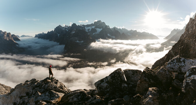 Traveler in cloudy morning in mountains
