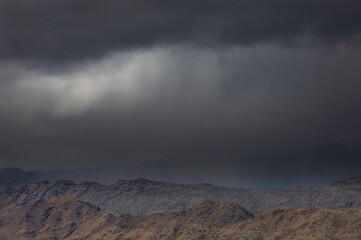 a storm in the desert mountains