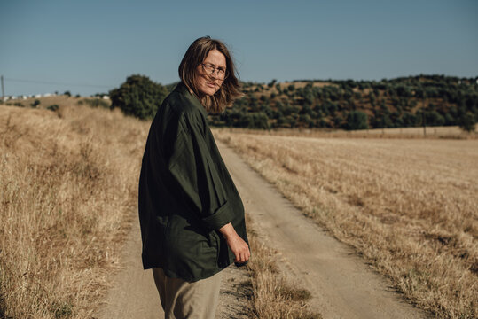 Woman in a countryside during sunny summer day