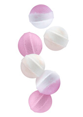Many different aromatic bath bombs falling on white background
