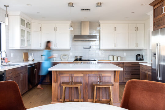 Woman Walks Through Kitchen Quickly