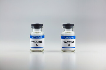 Coronavirus, covid-19 vaccine vials, isolated on neutral white. Effects of different or various kinds on corona virus vaccines.