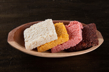 Cocada coconut candy, sweet Brazilian in background with rustic wood