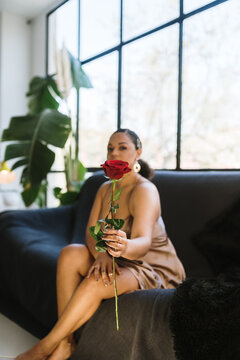 Woman handing a rose