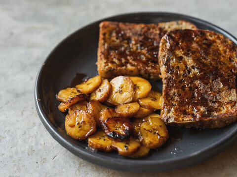 French toast with fried plantain and caramel sauce. 