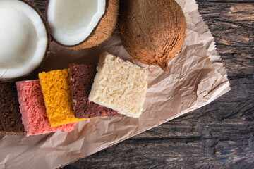 Cocada coconut candy, sweet Brazilian in rustic wood background