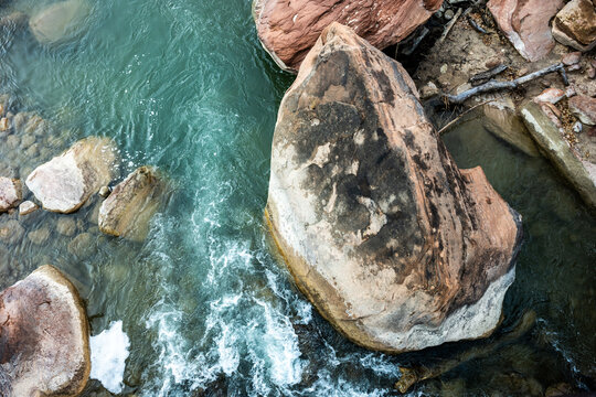 Blue Waters Of The Virgin River Swirl Around Rocks