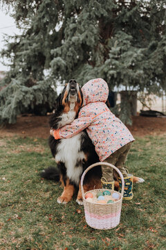 Young Girl Hugging Her Dog on Easter