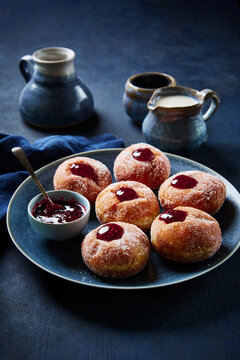 Raspberry Jelly Filled Donuts with Creamer and Pitchers
