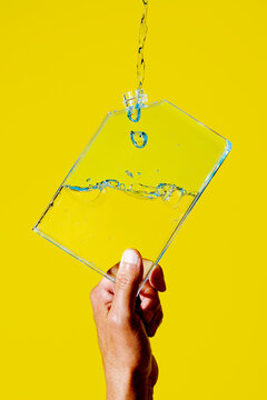 man pours water from a bottle