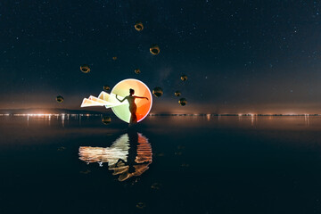 Silhouette of a woman on light painting