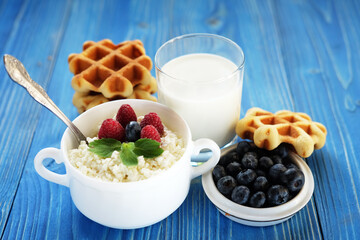 Cottage cheese with fresh berries, waffles and milk