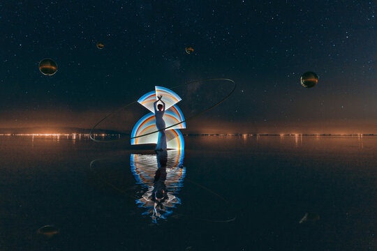 Silhouette of a woman on light painting