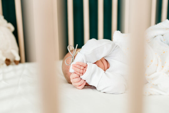 Baby covers her face