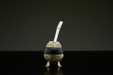 handcrafted mate with metal edges and legs on grey background