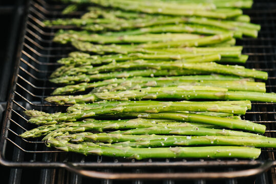 Asparagus spears cooking on a grill