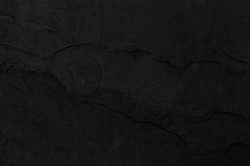 Naklejka premium Dark grey black slate background or texture. Black granite slabs background