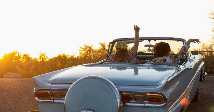 Road Trip Celebration in Vintage Car in Arizona at Sunset