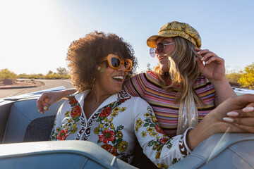 Young Friends Riding In Convertible Car 