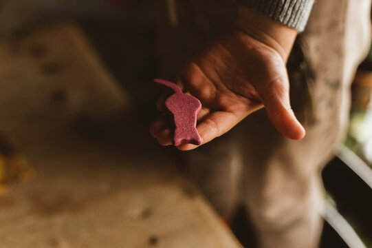 A child's hand with a toy