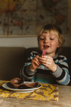 A child opening a chocolate easter egg