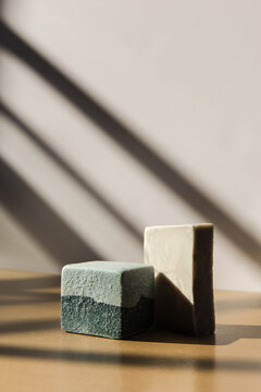 Two soap bars in a sunny studio 