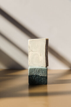 Stacked soap bars in a sunny studio 