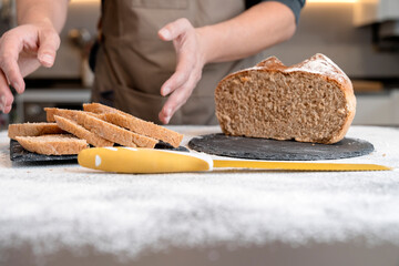 Man plating slices of bread